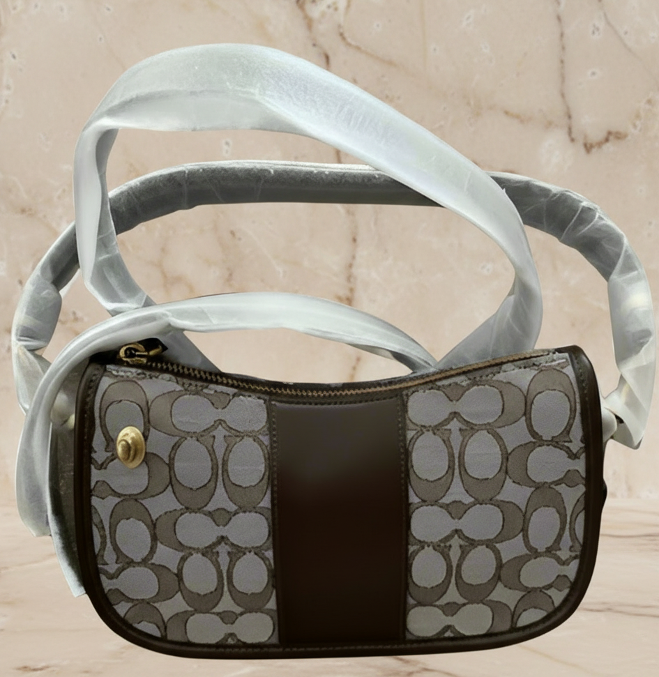 تخفيضات هائلة! ‼️‼️ حقيبة يد من قماش الجاكار من ماركة كوتش - بدون بطاقة السعر