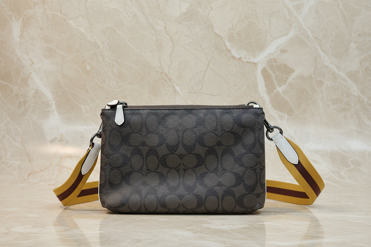 COACH EVERETTE CROSSBODY IN SIGNATURE CANVAS WITH VARSITY MOTIF