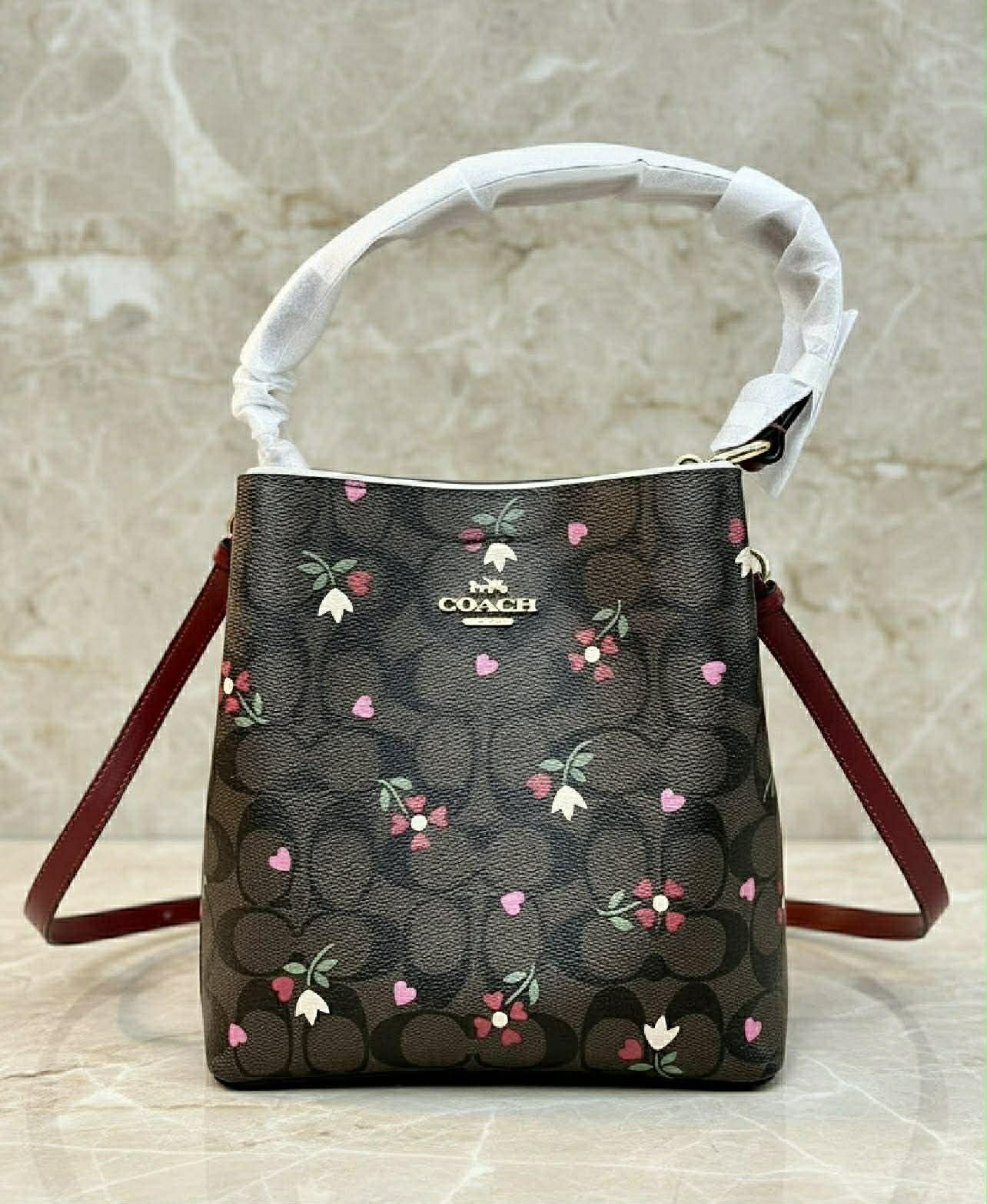 COACH SMALL TOWN BUCKET IN SIGNATURE CANVAS WITH HEART PETAL PRINT