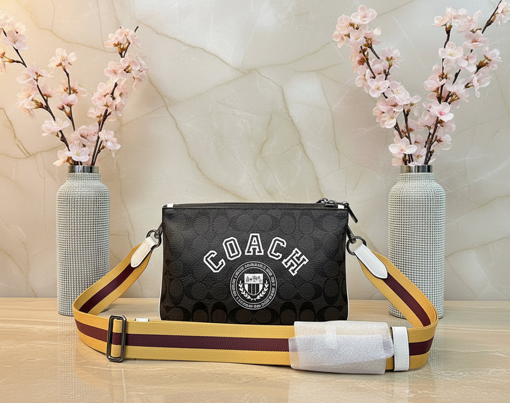COACH EVERETTE CROSSBODY IN SIGNATURE CANVAS WITH VARSITY MOTIF