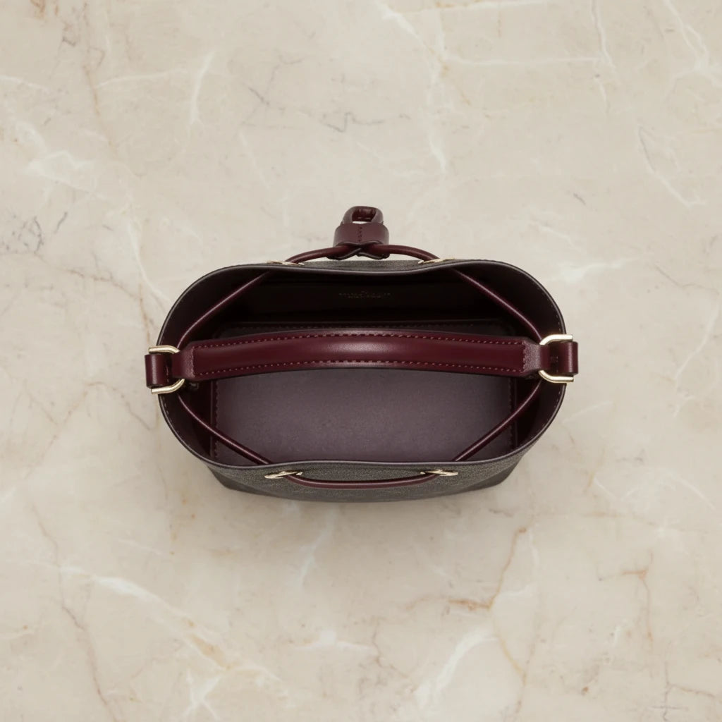 MICHAEL KORS SURI BUCKET IN SIGNATURE CANVAS