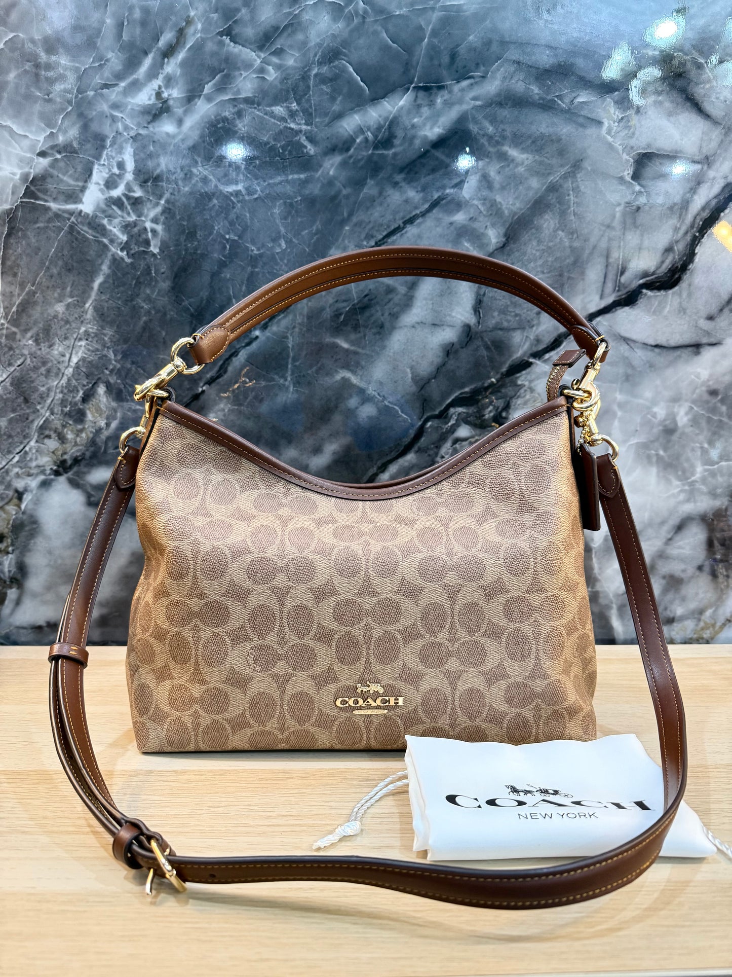 COACH MEDIUM LAUREL SIGNATURE COATED CANVAS