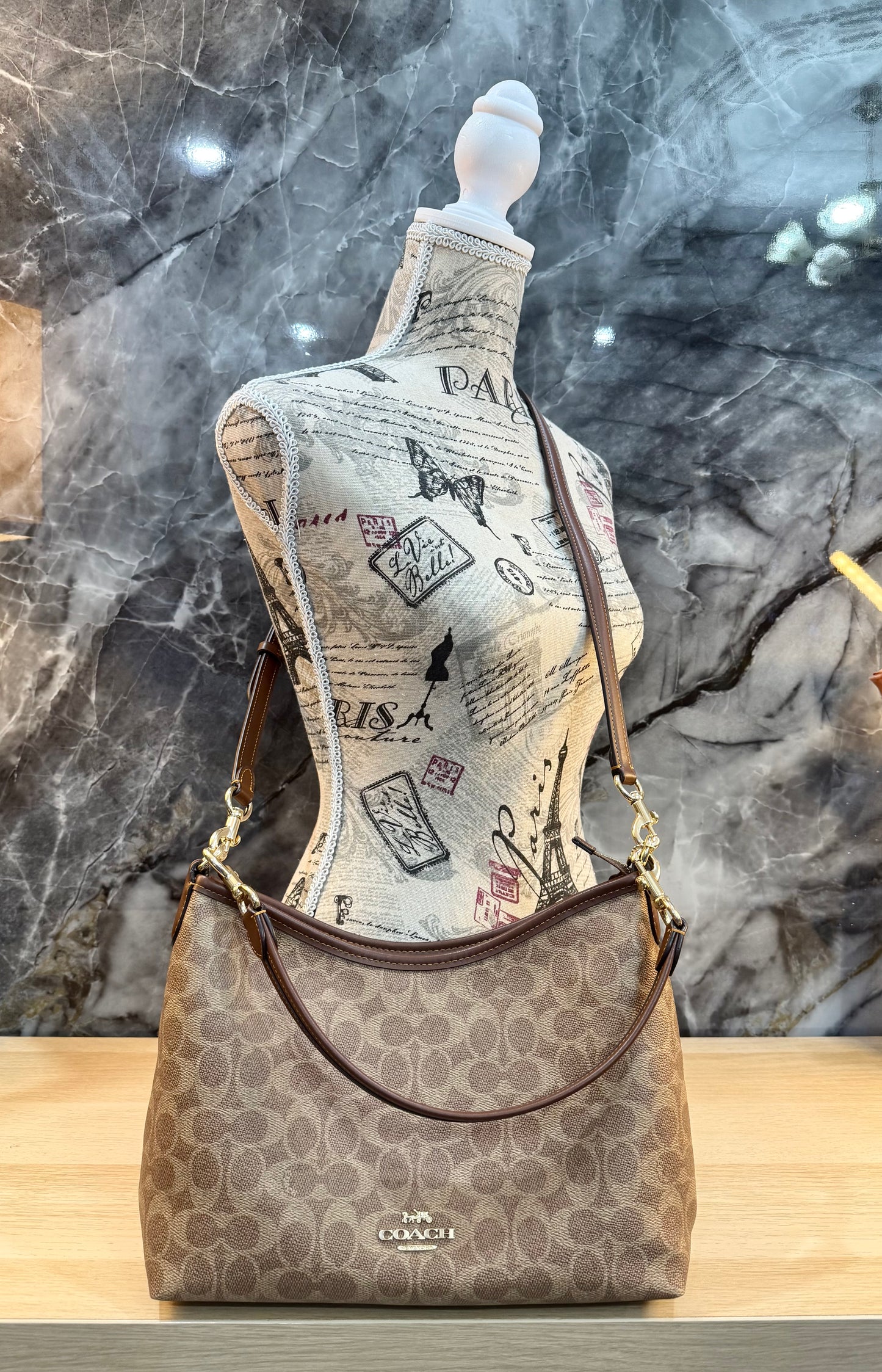 COACH MEDIUM LAUREL SIGNATURE COATED CANVAS