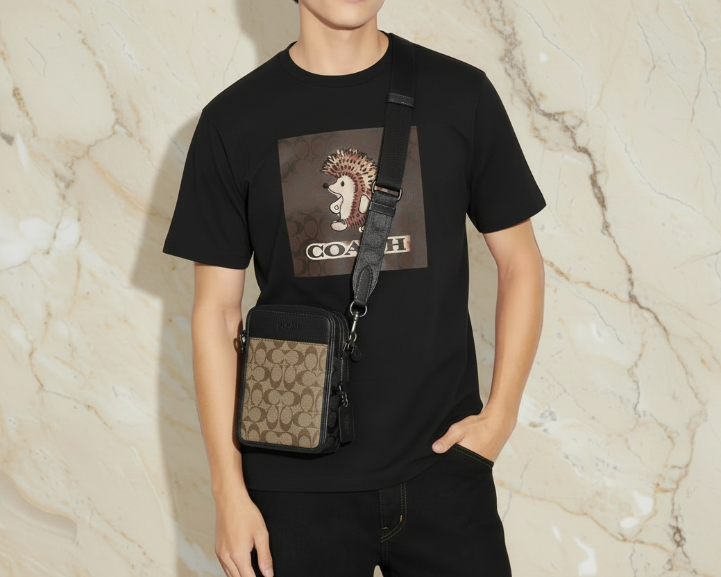 حقيبة كروسبودي من كوتش سوليفان، لون بني/أسود