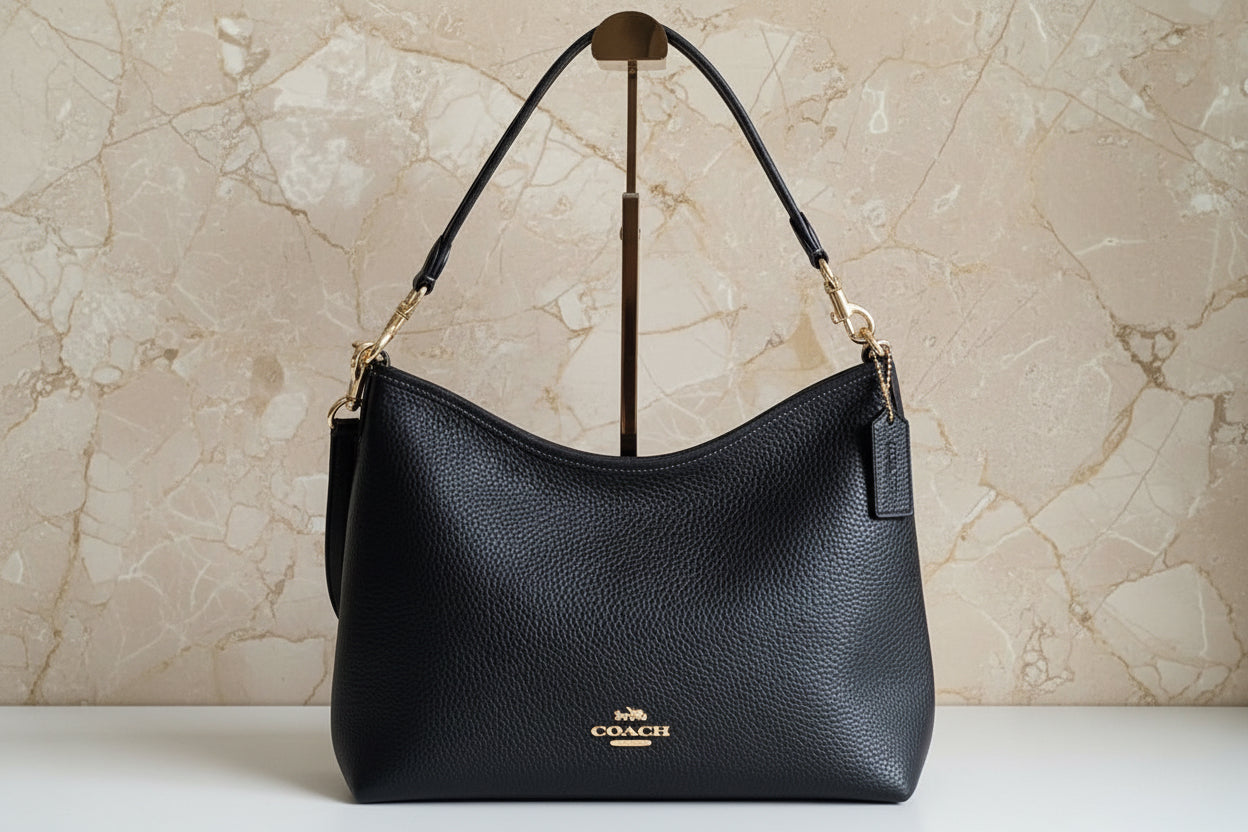 حقيبة كوتش متوسطة الحجم بلون الغار - أسود