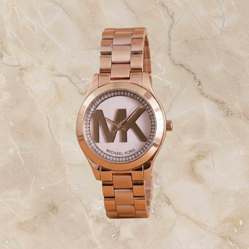 ساعة مايكل كورس ميني سليم رانوي - لون ذهبي وردي - بشعار MK وتصميم مرصع بالكريستال - علبة ساعة مجانية 