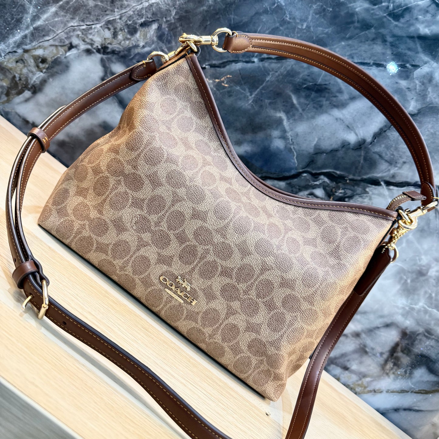 COACH MEDIUM LAUREL SIGNATURE COATED CANVAS