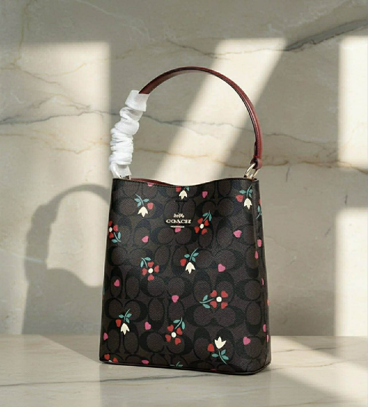 COACH SMALL TOWN BUCKET IN SIGNATURE CANVAS WITH HEART PETAL PRINT