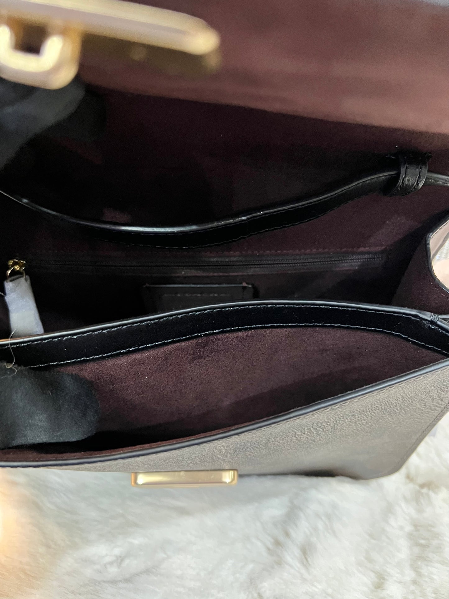 حقيبة كوتش برين فليب من قماش الكانفاس المميز باللونين البني والأسود