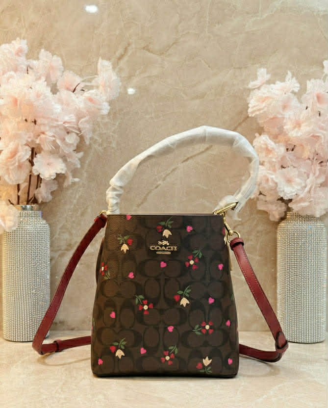 COACH SMALL TOWN BUCKET IN SIGNATURE CANVAS WITH HEART PETAL PRINT