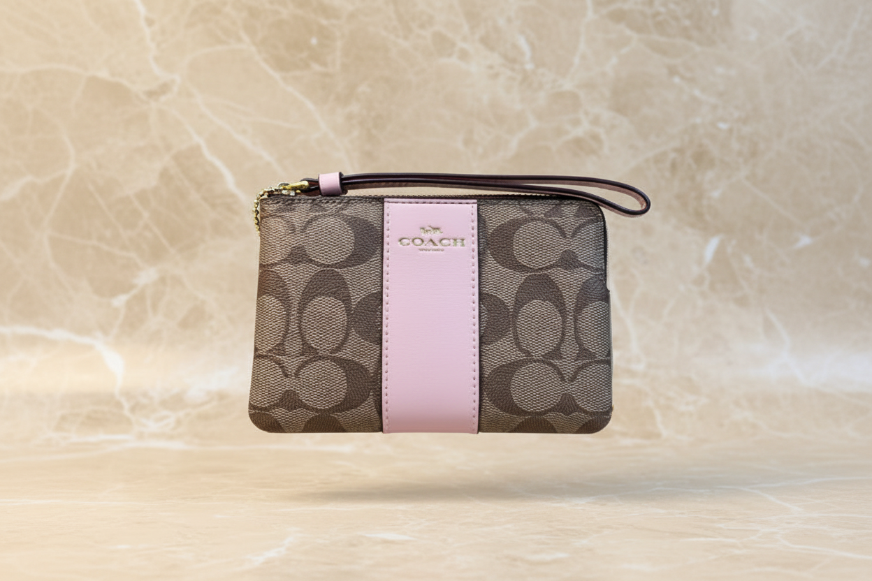 COACH SMALL CORNER SINGLE ZIP WRISTLET - SIGNATURE BROWN/PINK