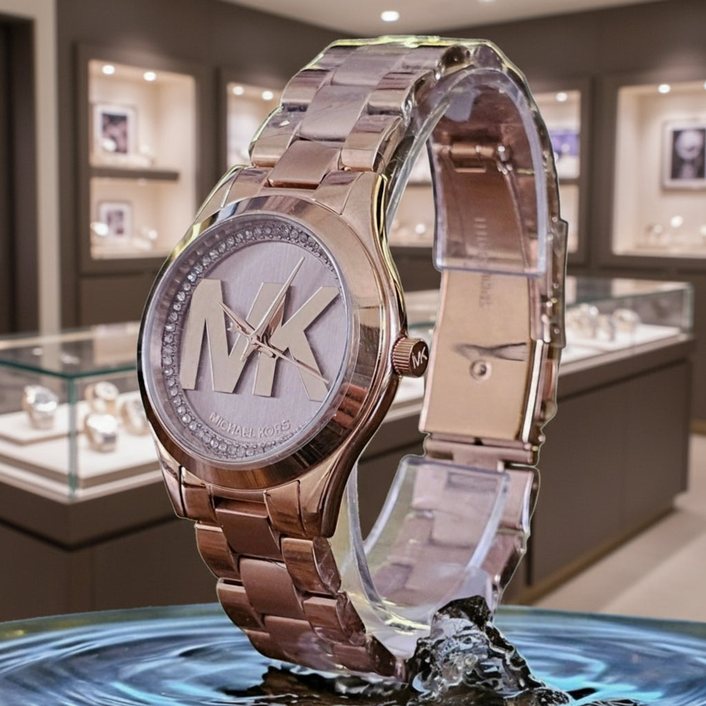 ساعة مايكل كورس ميني سليم رانوي - لون ذهبي وردي - بشعار MK وتصميم مرصع بالكريستال - علبة ساعة مجانية 