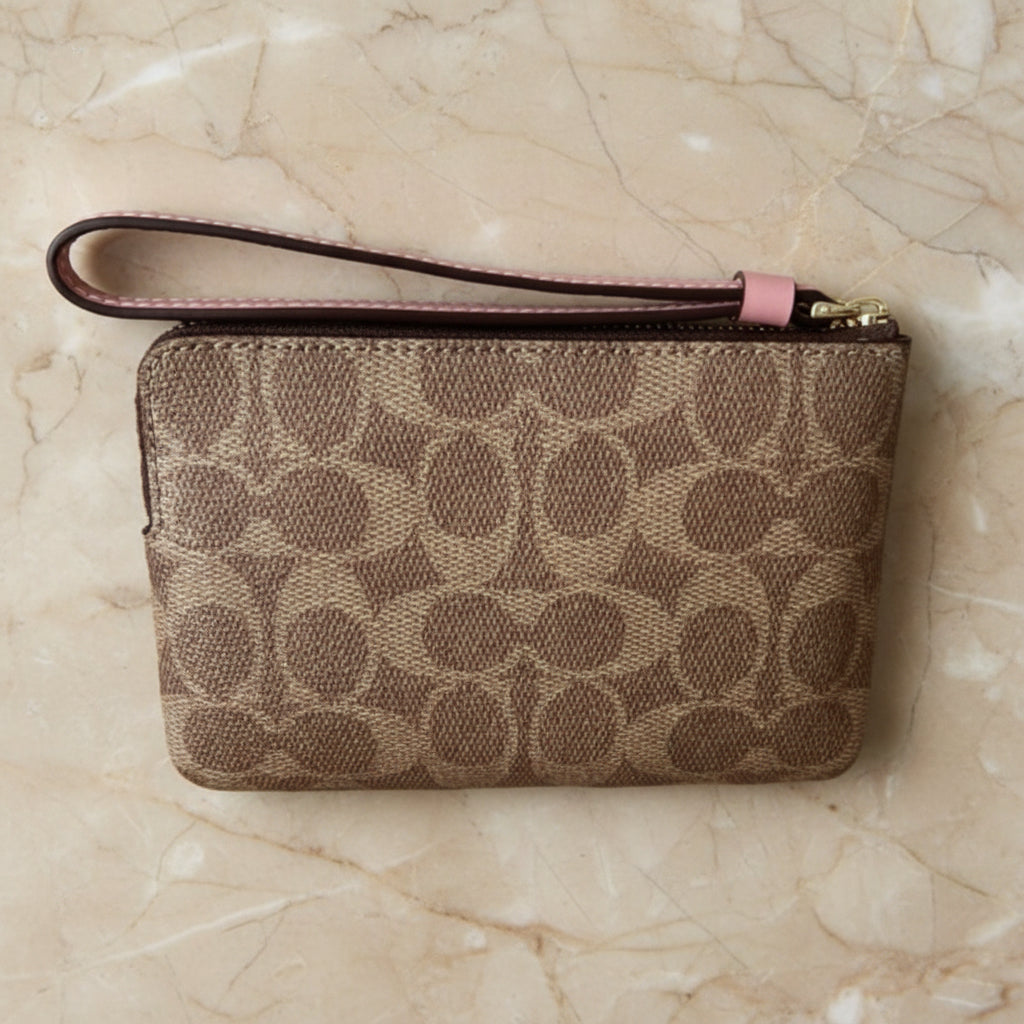 COACH SMALL CORNER SINGLE ZIP WRISTLET - SIGNATURE BROWN/PINK