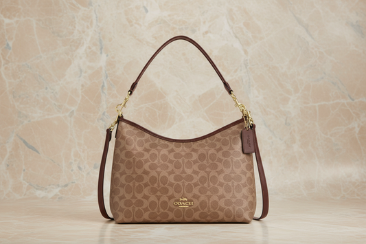 حقيبة كوتش متوسطة الحجم من قماش الكانفاس المطلي بتوقيع لوريل