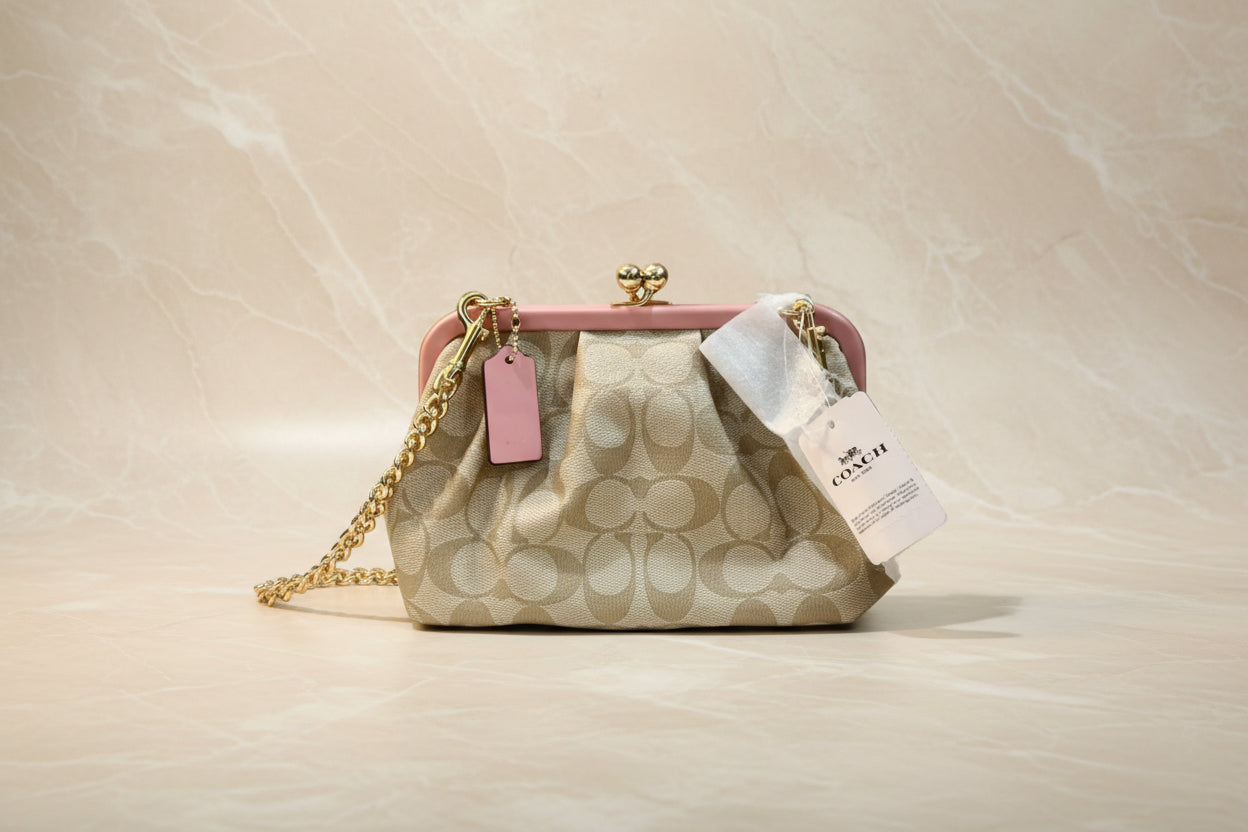 COACH NORA KISSLOCK CLUTCH/CROSSBODY IN SIGNATURE CHALK/IVORY/PINK