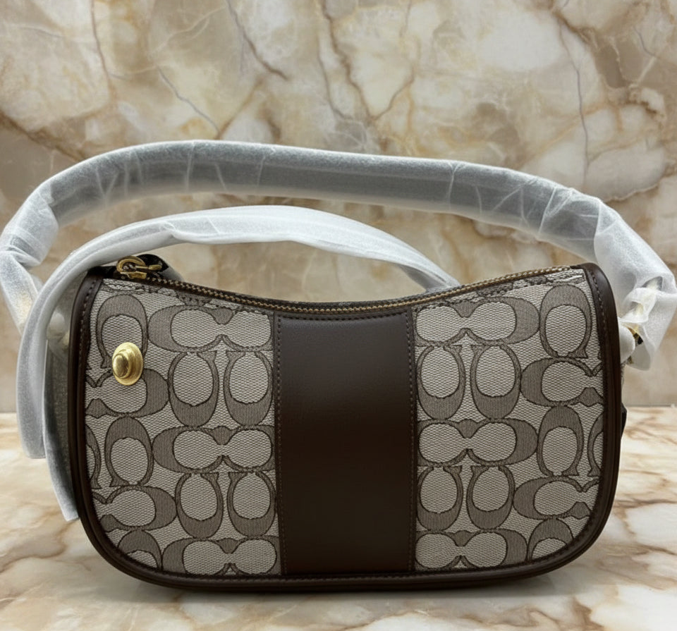 تخفيضات هائلة! ‼️‼️ حقيبة يد من قماش الجاكار من ماركة كوتش - بدون بطاقة السعر