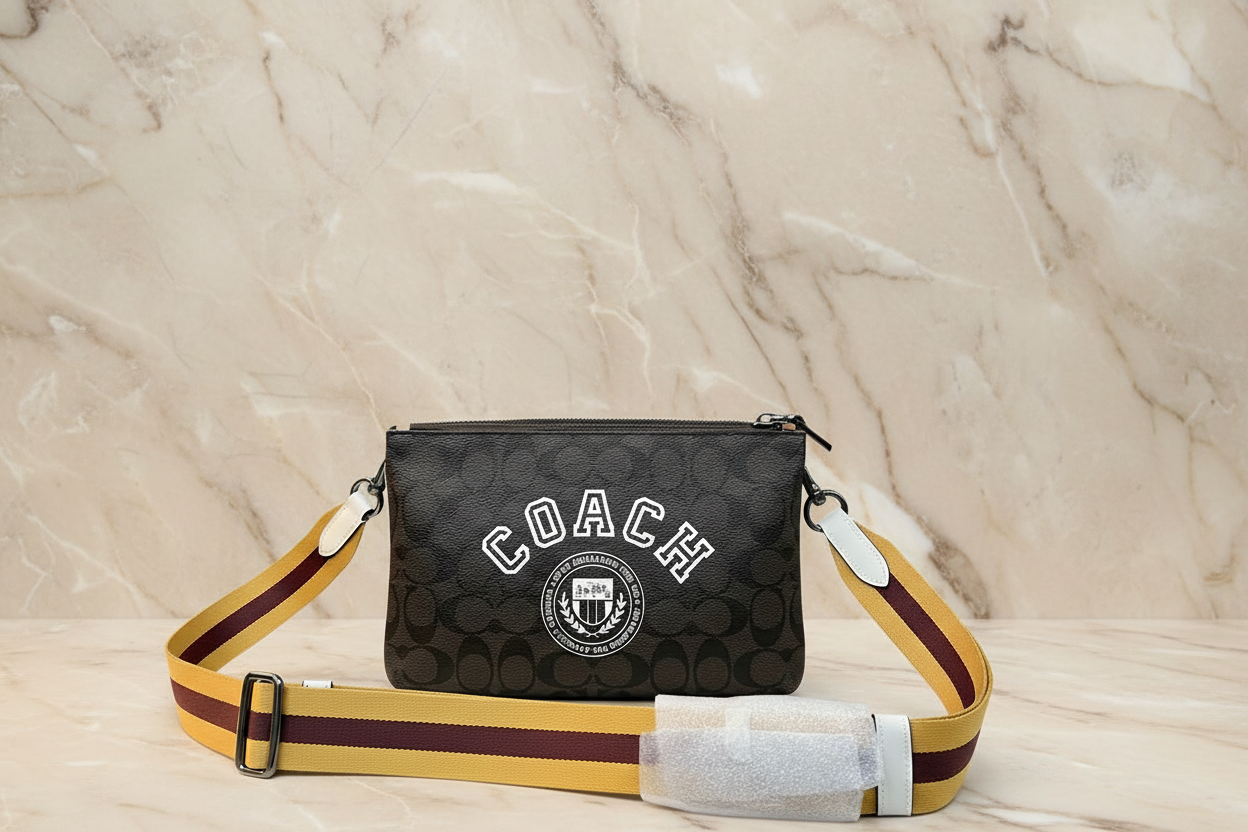 COACH EVERETTE CROSSBODY IN SIGNATURE CANVAS WITH VARSITY MOTIF