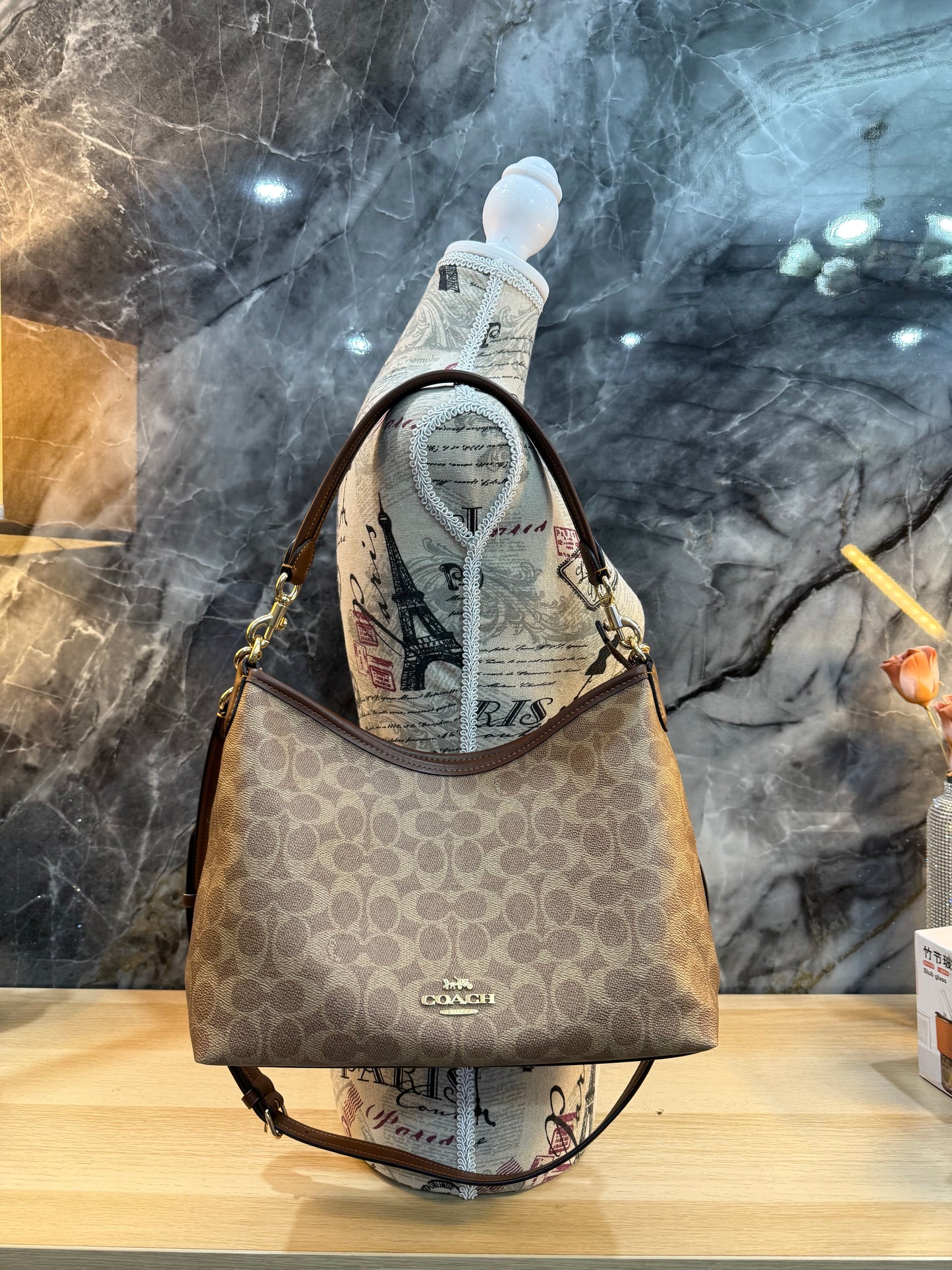 COACH MEDIUM LAUREL SIGNATURE COATED CANVAS