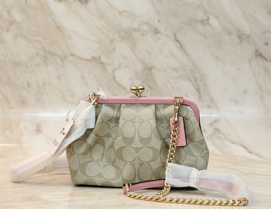 COACH NORA KISSLOCK CLUTCH/CROSSBODY IN SIGNATURE CHALK/IVORY/PINK