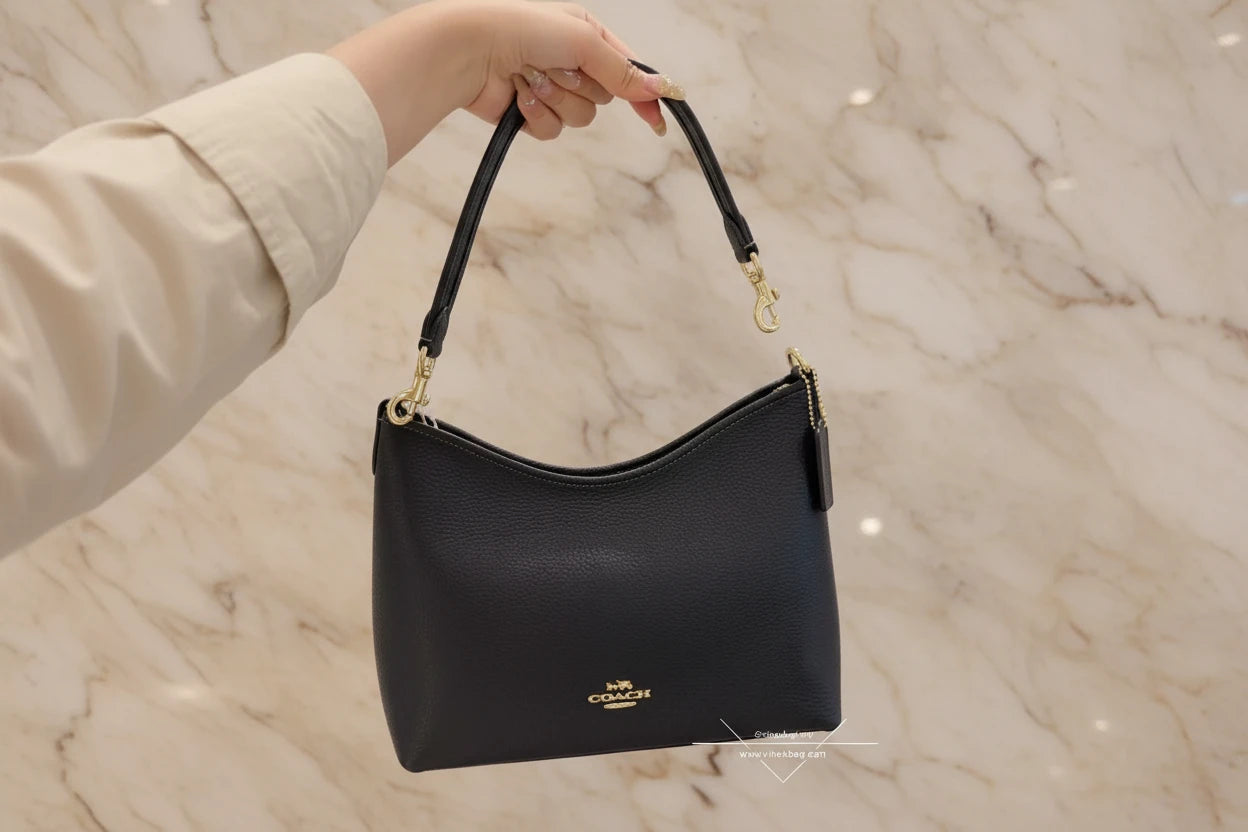 حقيبة كوتش متوسطة الحجم بلون الغار - أسود