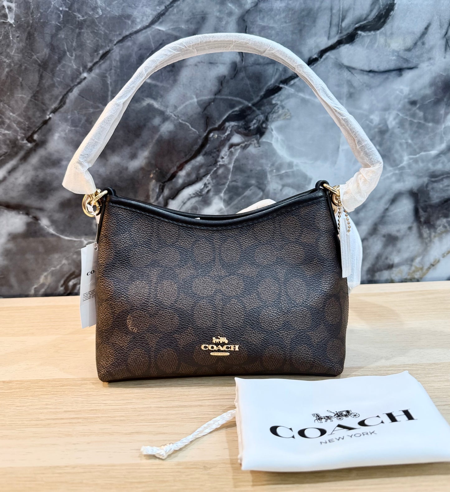 COACH SMALL LAUREL SIGNATURE COATED CANVAS