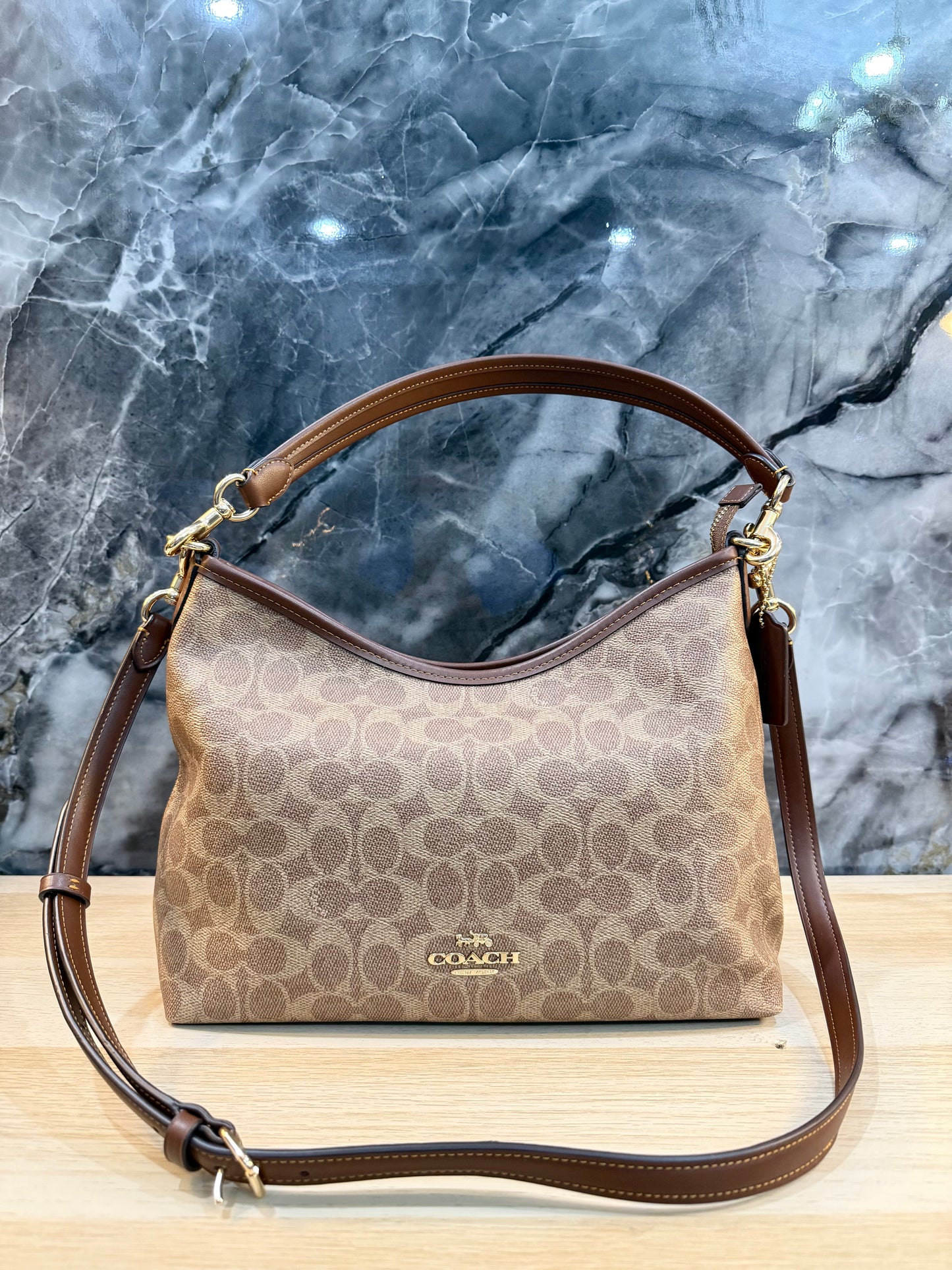 COACH MEDIUM LAUREL SIGNATURE COATED CANVAS
