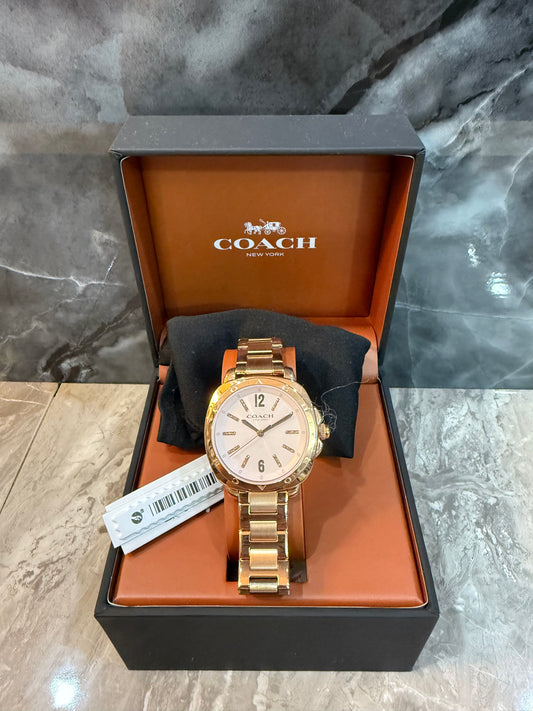 ساعة كوتش كيت النسائية - لون ذهبي وردي