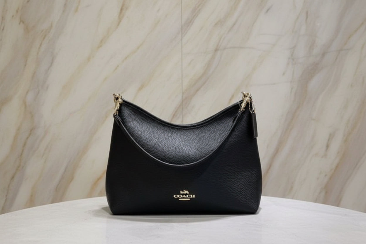 حقيبة كوتش متوسطة الحجم بلون الغار - أسود