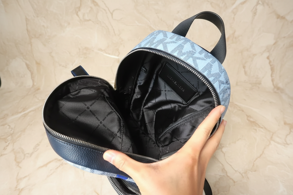 MICHAEL KORS COOPER COMMUTER SLINGPACK CHAMBRAY