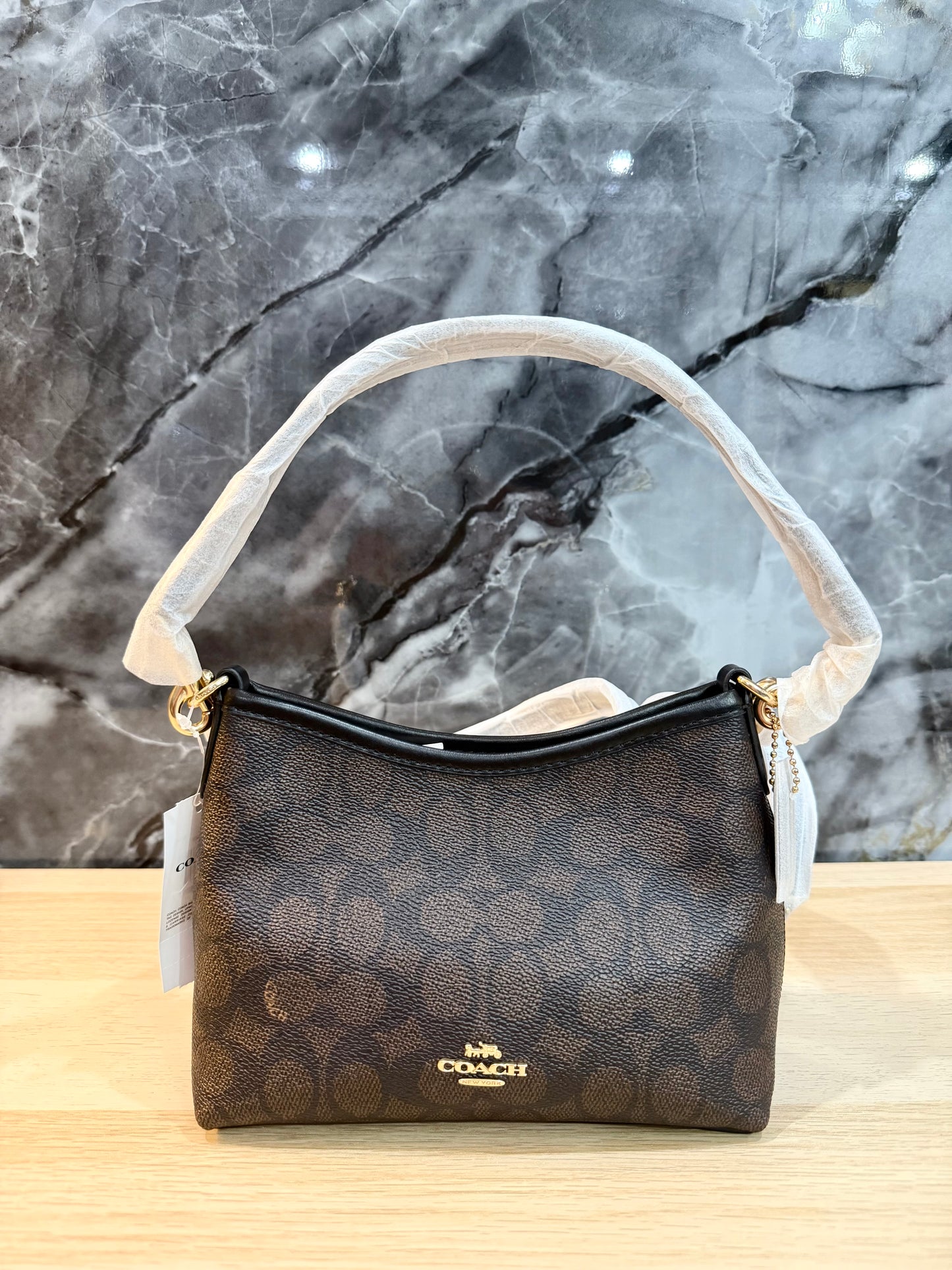 COACH SMALL LAUREL SIGNATURE COATED CANVAS