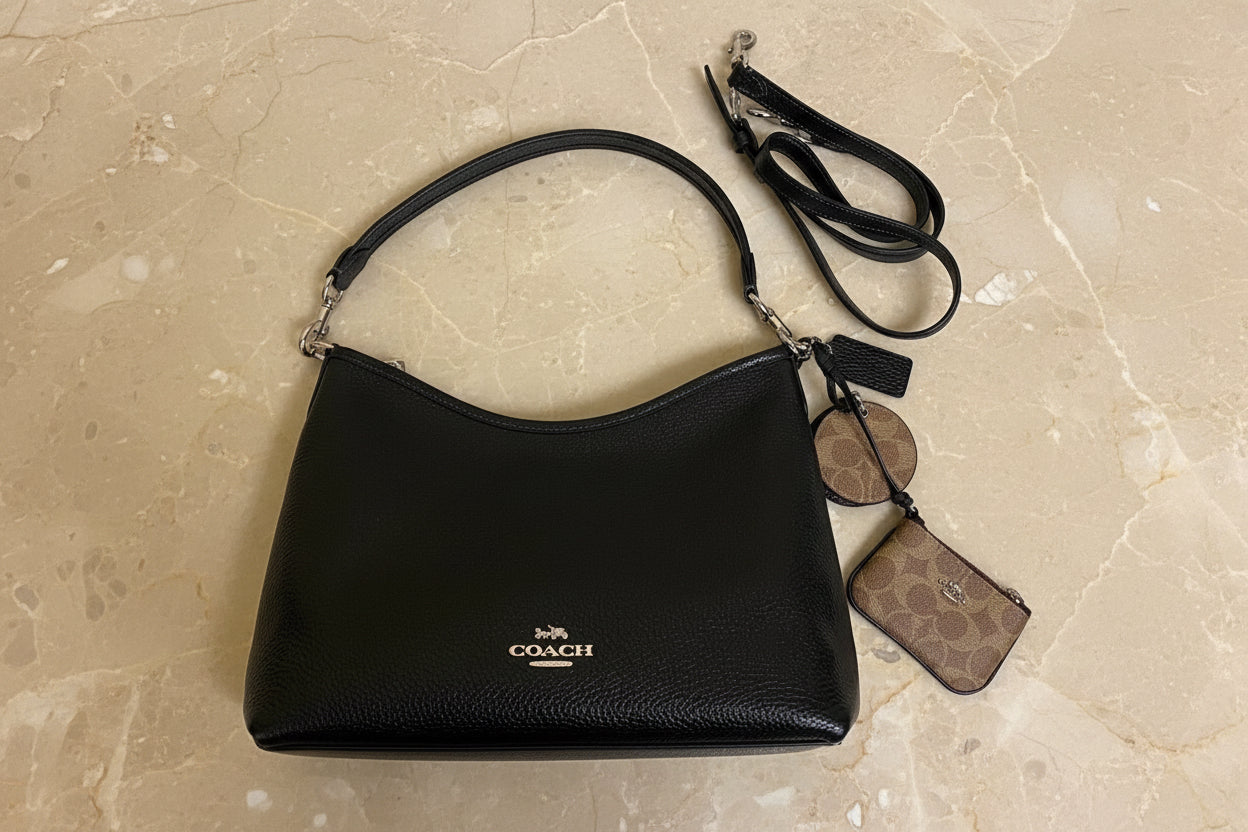 حقيبة كوتش متوسطة الحجم بلون الغار - أسود