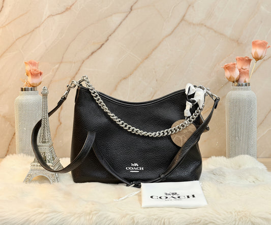 حقيبة كوتش متوسطة الحجم بلون الغار - أسود