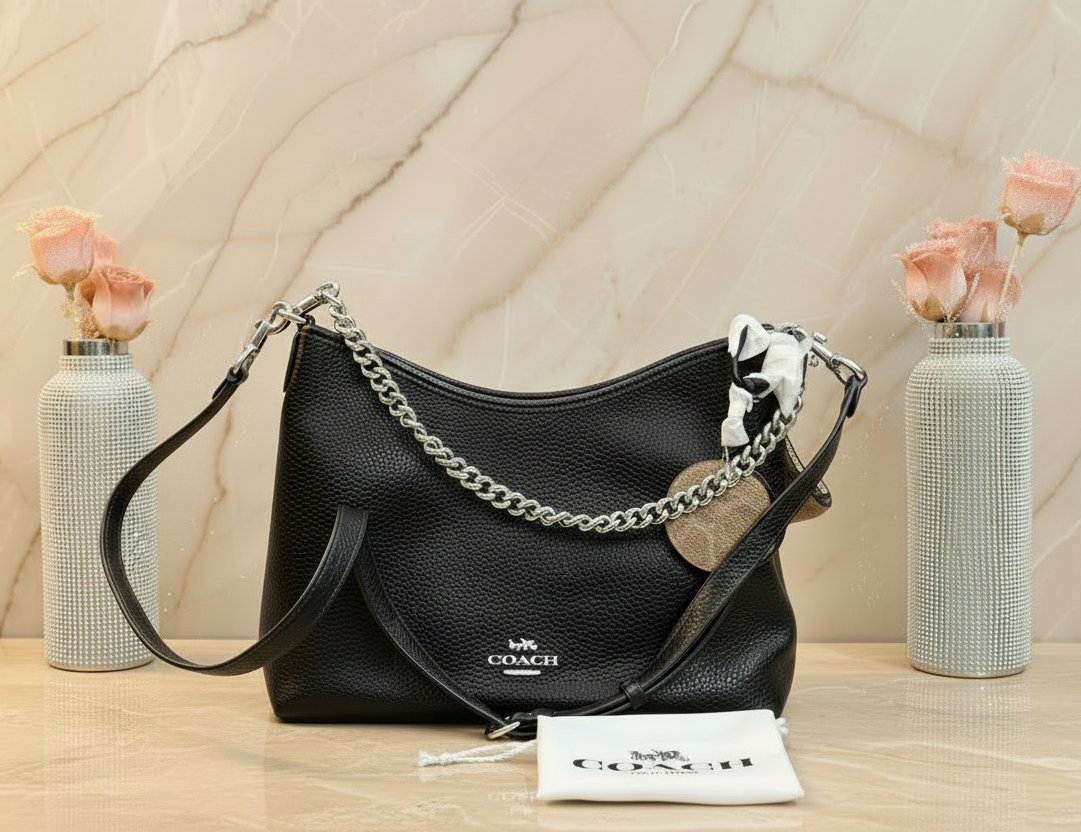 حقيبة كوتش متوسطة الحجم بلون الغار - أسود